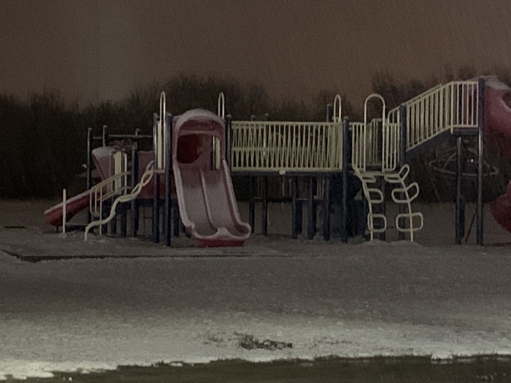 Snow on playground equipment